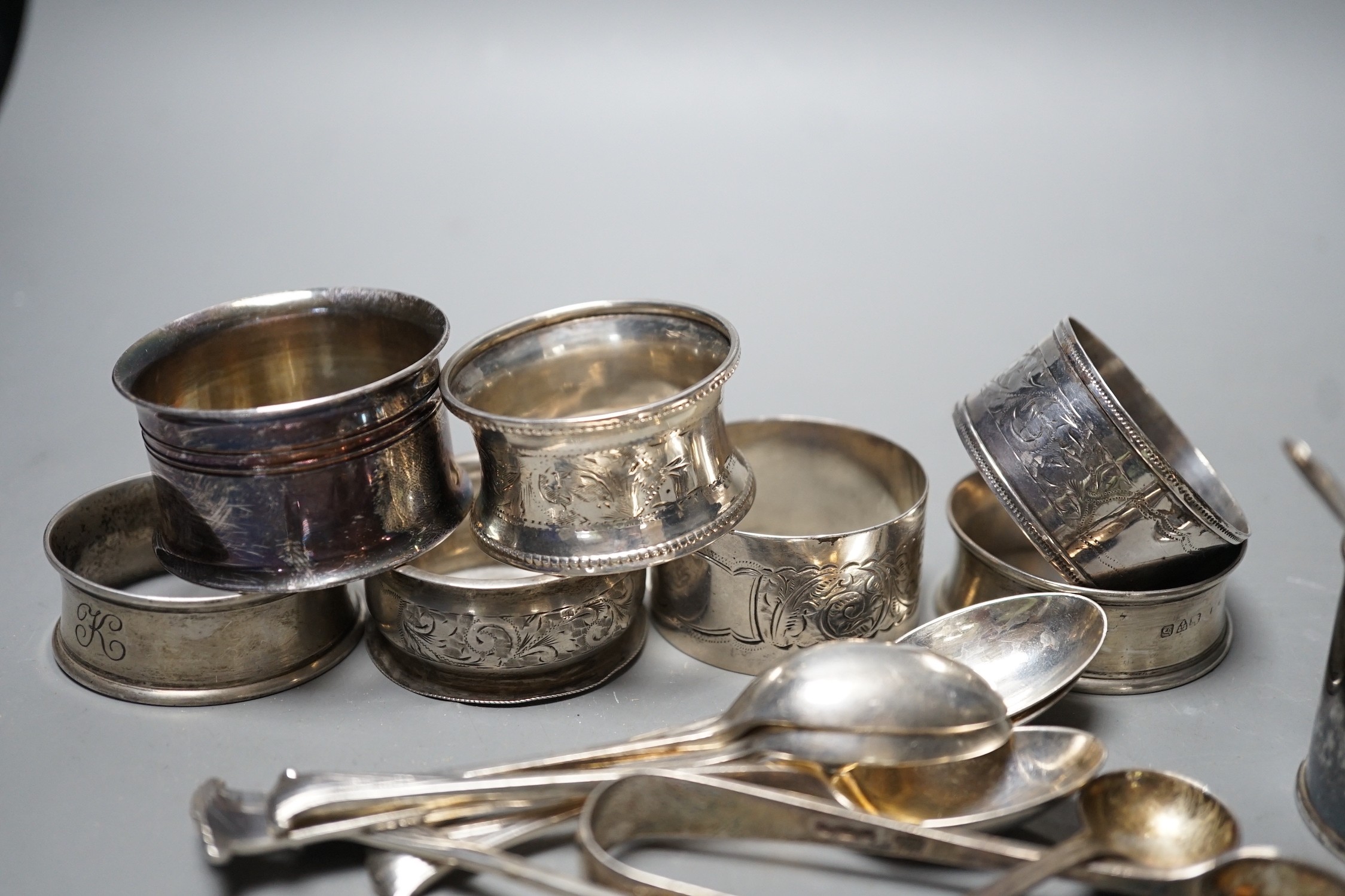 An Edwardian silver mustard pot, Birmingham, 1905, a set of six 'Onslow' pattern silver teaspoons by William Hutton & Sons, London, 1903, a pair of silver sugar tongs, a silver condiment spoons, six assorted silver napki